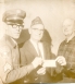 Don Raymakers and VFW Member Presenting a Check to Police Chief Bill Hietpas